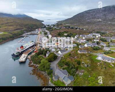 Aerial view from drone of Tarbert  with MV Hebrides Calmac ferry in port on Isle of Harris, outer Hebrides, Scotland, UK Stock Photo