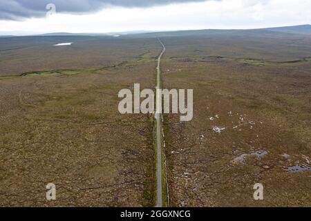 Aerial view form drone of the bleak and desolate Pentland Road crossing moorland on on Isle of Lewis, Outer Hebrides, Scotland, UK Stock Photo