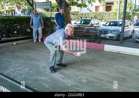Bracciano, Italy. 03rd Sep, 2021. Italian men  enjoy playing Bocce on a hot summer day under a shaded area. Bocce is a ball sport which is similar to  British bowls and French pétanque and is played around Europe and by Italian immigrants in Australia and North America.  Credit: amer ghazzal/Alamy Live News Credit: amer ghazzal/Alamy Live News Stock Photo