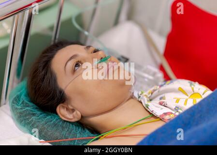 Woman being monitored in a recovery room Stock Photo