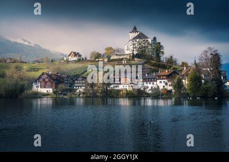 Skyline of Buchs with Werdenberg Castle and Werdenberg Lake - Buchs, Switzerland Stock Photo