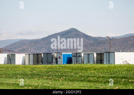 Elkton, USA - October 27, 2020: Rural Virginia countryside in Rockingham county area with parking lot and cargo shipment trucks by Shenandoah Blue rid Stock Photo