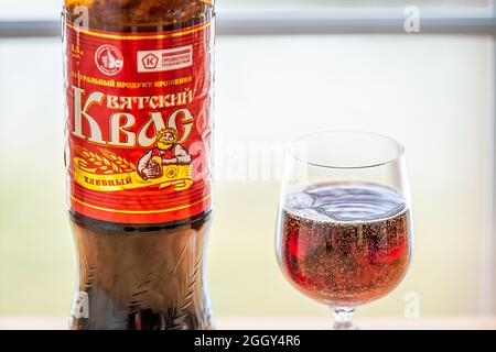 Herndon, USA - December 17, 2020: Closeup of bottle of storebought traditional Russian Kvass fermented bread drink with glass illustrative editorial b Stock Photo