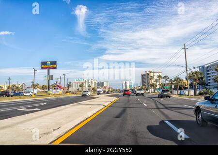 Destin, USA - January 13, 2021: Destin city town village view from highway with stores shops and traffic in Florida panhandle gulf of mexico winter Stock Photo