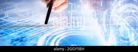 Business concept. Information technology and data processing. Hands over the screen graphic data. A modern software product in business. Stock Photo