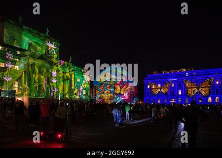 Berlin, Germany. 03rd Sep, 2021. Numerous people stand at the start of the 17th Festival of Lights on Bebelplatz. All the buildings there are illuminated. Credit: Paul Zinken/dpa/Alamy Live News Stock Photo