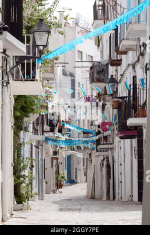 Buildings along the traditional quaint narrow cobbled side streets and passages of historic Ibiza old town, Eivissa, Balearic Islands, Spain Stock Photo
