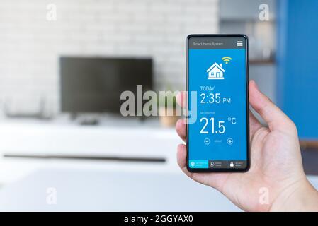 Smart home system on phone app. Temperature, energy efficiency, security control. Stock Photo