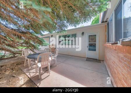 Back door exterior with glass near the windows and white garage door Stock Photo
