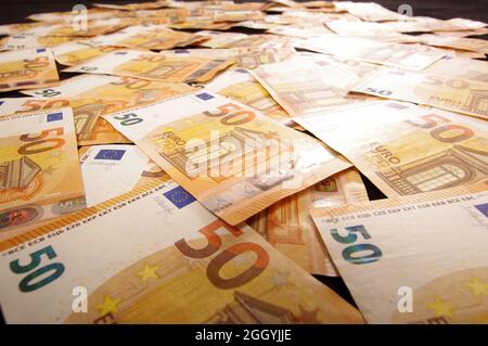 Many euro banknotes spread all over. Wealth and economy concept Stock Photo