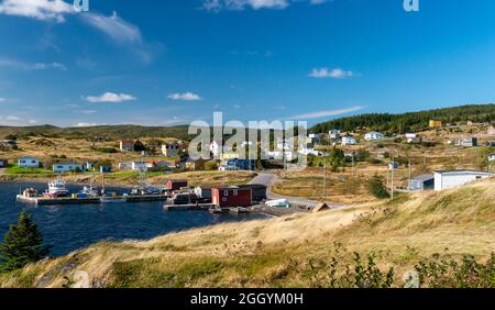 A view of Twillingate, Newfoundland, a small fishing village with a sheltered harbor surrounded by small fishing boats. Stock Photo