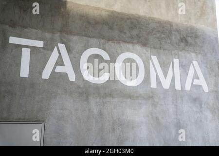 Concrete wall with Tacoma lettering at Tacoma, Washington Stock Photo