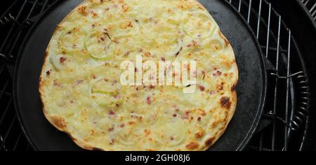 Tarte flambée fresh from the oven Stock Photo