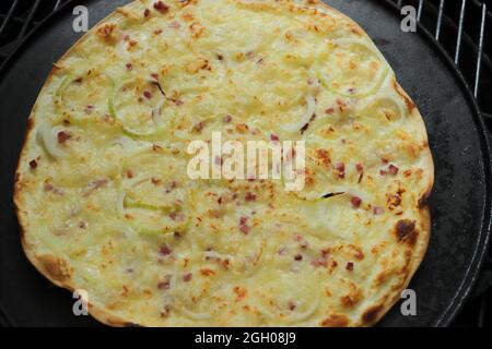 Tarte flambée fresh from the oven Stock Photo