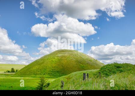 Silbury Hill, the prehistoric artificial chalk mound near Avebury in the England, Wiltshire, a UNESCO World Heritage Site. Stock Photo