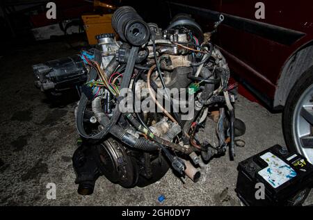 Open real car engines in the repair phase in a car mechanic shop Stock ...