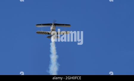 Ferrara Italy JUNE, 27, 2021 Display in flight of a Pitts Special plane with smoke. Christen Pitts S-2B Special Stock Photo