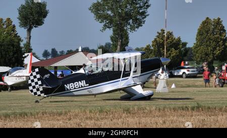 Ferrara Italy JUNE, 27, 2021 Biplane aircraft parked on the grass of a small airfield. Christen Pitts S-2B Special Stock Photo