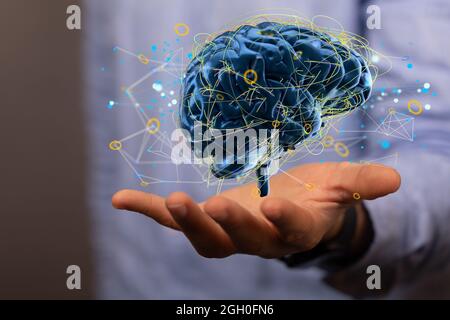 Artificial Intelligence and Machine Learning Concept- digital brain sign floating on a hand Stock Photo