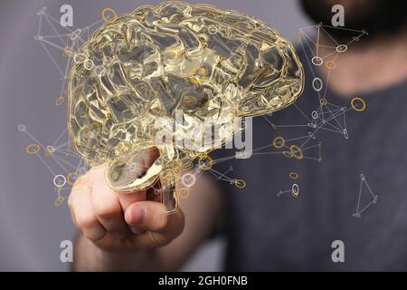 Artificial Intelligence and Machine Learning Concept- digital brain sign floating on a hand Stock Photo