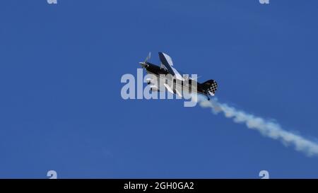 Ferrara Italy JUNE, 27, 2021 Extreme aerobatic maneuver in flight of a old airplane. Christen Pitts S-2B Special Stock Photo