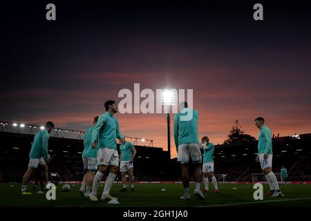 The sun sets over the Vitality Stadium as Blackburn Rovers warm up - AFC Bournemouth v Blackburn Rovers, Carabao Cup, Third Round, Vitality Stadium, Bournemouth - 25th September 2018 Stock Photo