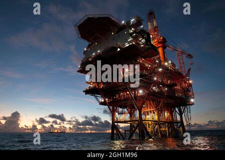Chinese Oil Rig, silhouetted before sunrise, horizontal view, Huizhou 19 Oil field, South China Sea 2nd Sept 2021 Stock Photo