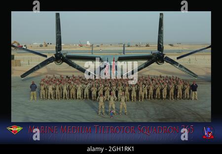 Marines from Marine Medium Tiltrotor Squadron 365, 3rd Marine Aircraft Wing (Forward), stand with an MV-22B Osprey on the flightline here during a group photo taken shortly after they took over the Osprey mission in Afghanistan in July.