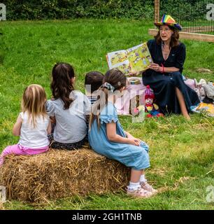 Childrens story time in the park Stock Photo