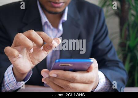businessman hand using smart phone while sited  Stock Photo