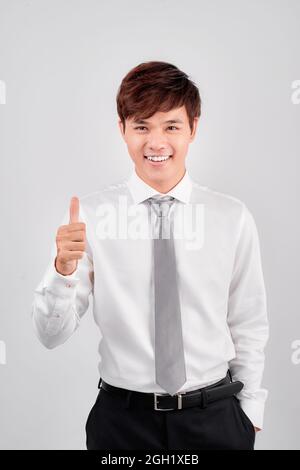 business and office concept - handsome buisnessman showing thumbs up Stock Photo