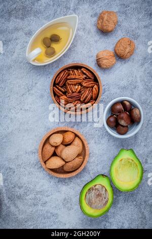 Selection food sources of omega 3 and unsaturated fats. super food high omega 3 and unsaturated fats for healthy food. Almond ,pecan ,hazelnuts,walnut Stock Photo