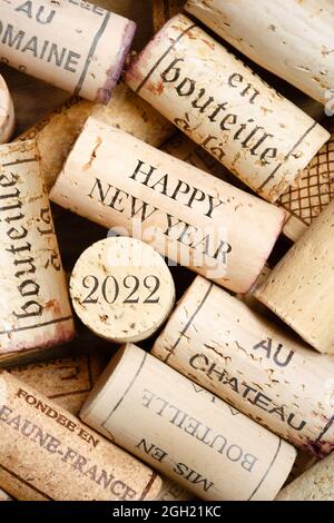 Happy New Year 2022 greeting card with wine corks. No visible trademarks Stock Photo