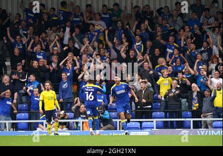 AFC Wimbledon's Will Nightingale celebrates the assist on their side's first goal of the game, scored by Jack Rudoni (not pictured) during the Sky Bet League One match at Plough Lane, London. Picture date: Saturday September 4, 2021. Stock Photo