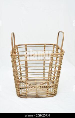 rattan laundry basket with soft-focus on the white background Stock Photo