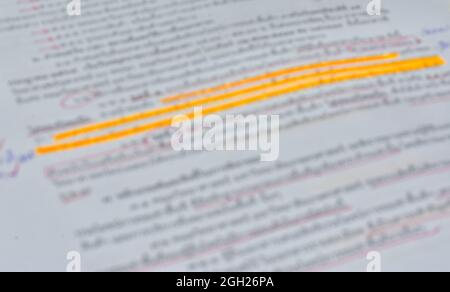 Blurred document with written note and highlighting text. Closeup shot for background Stock Photo