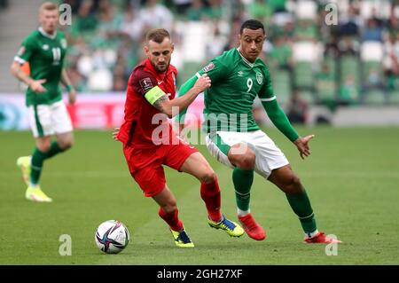 Republic of Ireland's Adam Idah (right) and Azerbaijan’s Maksim Medvedev during the 2022 FIFA World Cup Qualifying match at the Aviva Stadium, Dublin. Picture date: Saturday September 4, 2021. Stock Photo