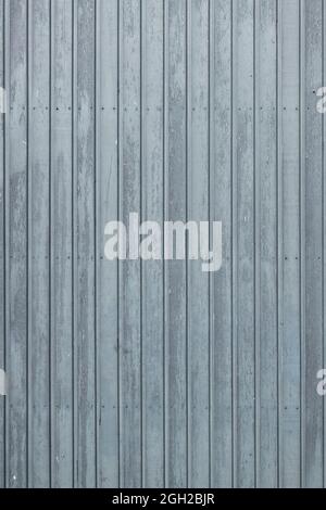 Standing photo of vertical gray-blue wooden planks at a cattle barn in the Netherlands Stock Photo