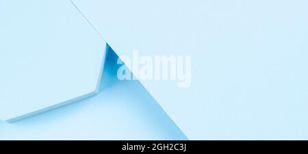 Abstract light blue color background. Top view to hexagon geometric shape turquoise podium for product display and geometric shape colored paper Stock Photo