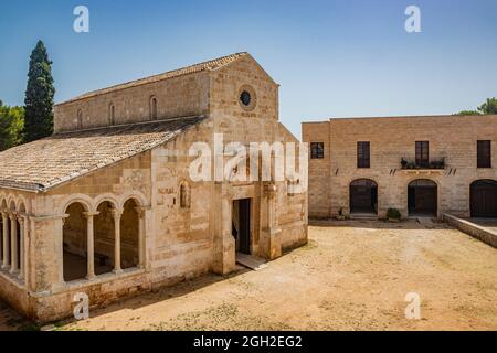 August 10, 2021 - Abbey of Santa Maria a Cerrate, Puglia, Salento, Lecce - Ancient Romanesque church, heritage of the FAI. The facade and the portico Stock Photo
