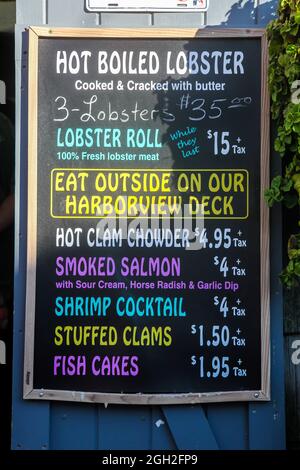 ROCKPORT, MASSACHUSETTS, USA - AUGUST 08, 2014: Informative sign from Roy Moore Lobster Company store and restaurant Stock Photo