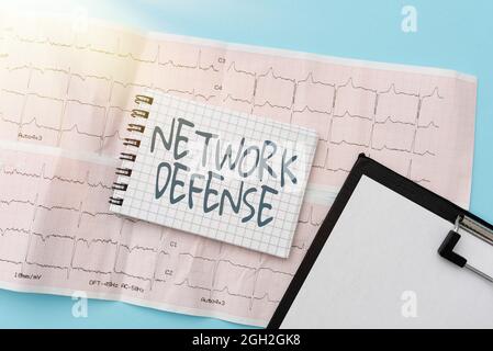 Writing displaying text Network Defense. Business approach easures to protect and defend information from disruption Reading Graph And Writing Stock Photo