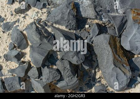 Debris of broken concrete cement rubble with a large and small debris. Close up photo. Picture can be used as a pattern or background. Stock Photo