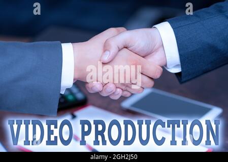 Writing displaying text Video Production. Business concept process of converting an idea into a video Filmaking Two Professional Well-Dressed Stock Photo