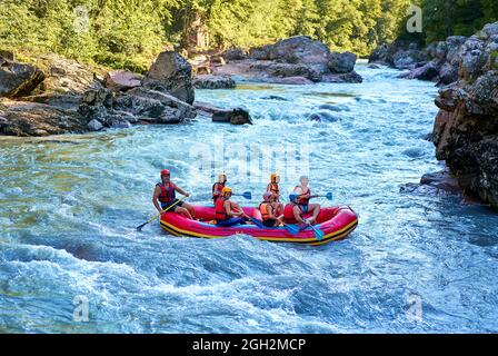 rafting on a large boat on a mountain river Stock Photo