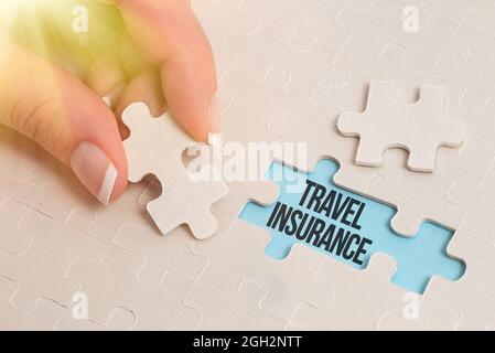 Hand writing sign Travel Insurance. Business concept covers the costs and losses associated with traveling Building An Unfinished White Jigsaw Pattern Stock Photo