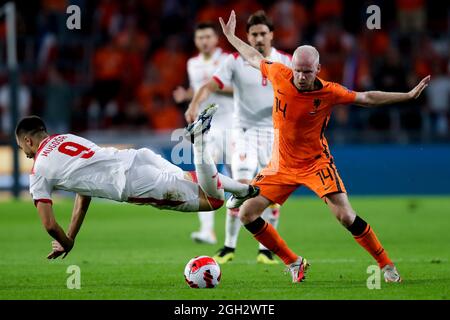 EINDHOVEN, NETHERLANDS - SEPTEMBER 4: Stefan Mugosa of Montenegro and Davy Klaassen of the Netherlands during the 2022 FIFA World Cup Qualifier match between Netherlands and Montenegro at the Philips Stadion on September 4, 2021 in Eindhoven, Netherlands (Photo by Peter Lous/Orange Pictures) Credit: Orange Pics BV/Alamy Live News Stock Photo