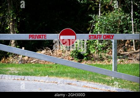 Staff entrance sign on private gate at workplace Stock Photo