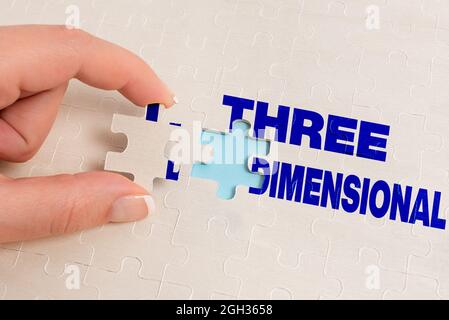 Text caption presenting Three Dimensional. Business concept Things that have depth and can be rotated in space Building An Unfinished White Jigsaw Stock Photo