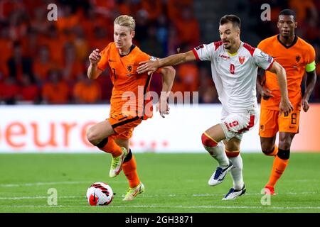 EINDHOVEN, NETHERLANDS - SEPTEMBER 4: Frenkie de Jong of the Netherlands and Stefan Mugosa of Montenegro during the 2022 FIFA World Cup Qualifier match between Netherlands and Montenegro at the Philips Stadion on September 4, 2021 in Eindhoven, Netherlands (Photo by Herman Dingler/Orange Pictures) Credit: Orange Pics BV/Alamy Live News Stock Photo